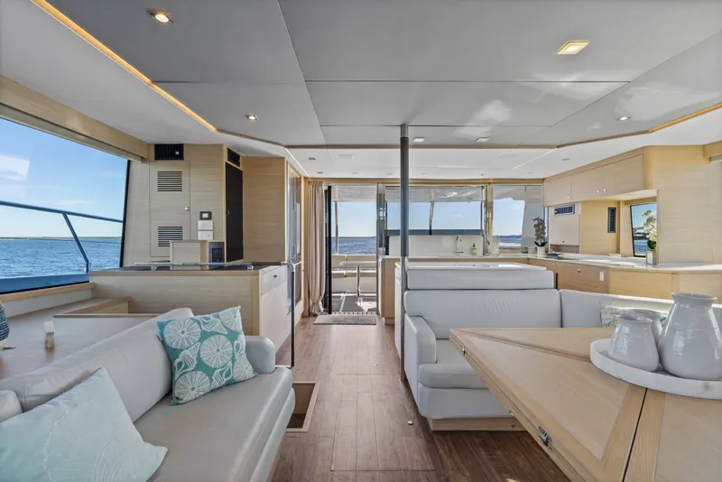 Slide: The Image of Luxurious interior of 2021 Aquila 54 Yacht with modern furnishings and ocean view. - 13