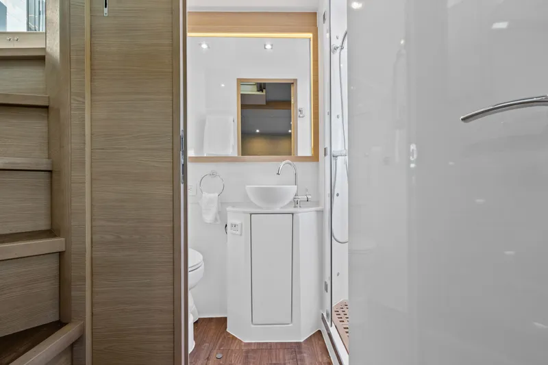 Slide: The Image of Modern bathroom interior on 2021 Aquila 54 Yacht, featuring sleek design and wooden accents. - 28
