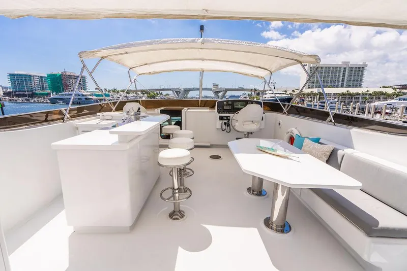 Slide: The Image of 2001 Intermarine Raised Pilothouse yacht with spacious flybridge and modern seating area. - 26