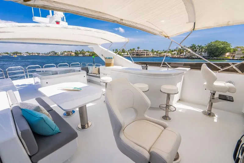 Slide: The Image of Luxurious 2001 Intermarine Raised Pilothouse yacht with spacious outdoor seating and scenic water views. - 25