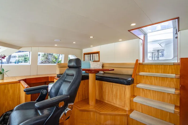 Slide: The Image of Interior of 2001 Intermarine Raised Pilothouse yacht with seating and captain's chair. - 22