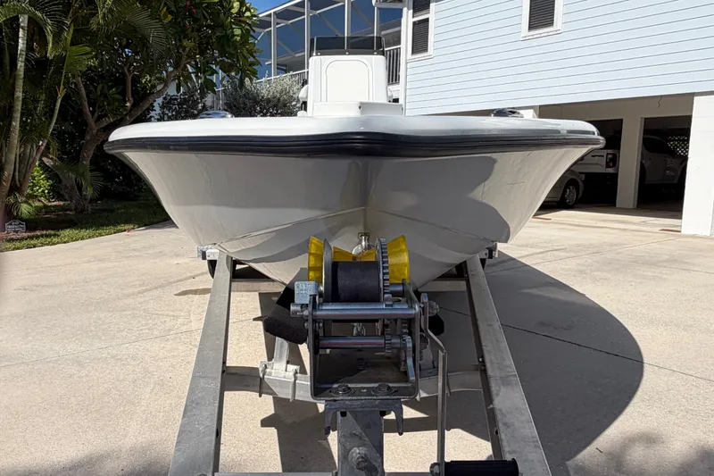 Slide: The Image of 2018 Yellowfin 21 Bay boat on trailer in driveway, front view. - 3