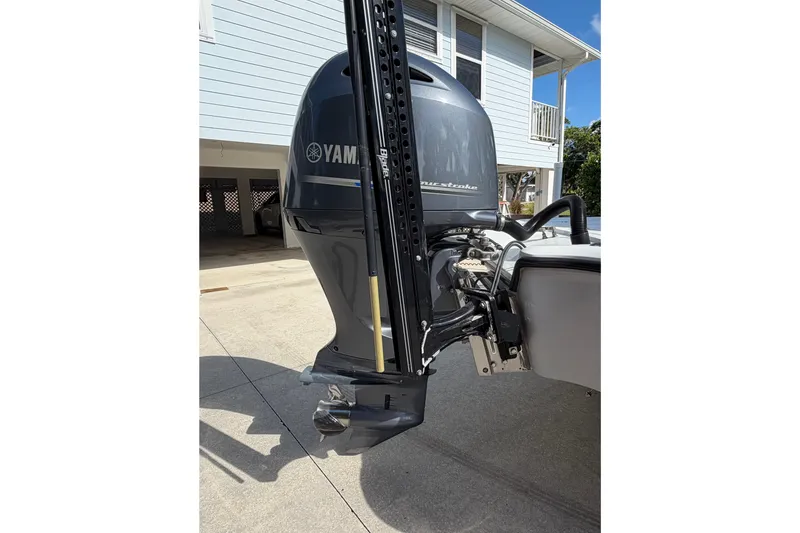 Slide: The Image of 2018 Yellowfin 21 Bay boat with Yamaha outboard motor in driveway. - 11