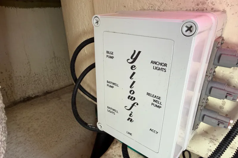 Slide: The Image of Control panel of a 2018 Yellowfin 21 Bay boat with labeled switches. - 27