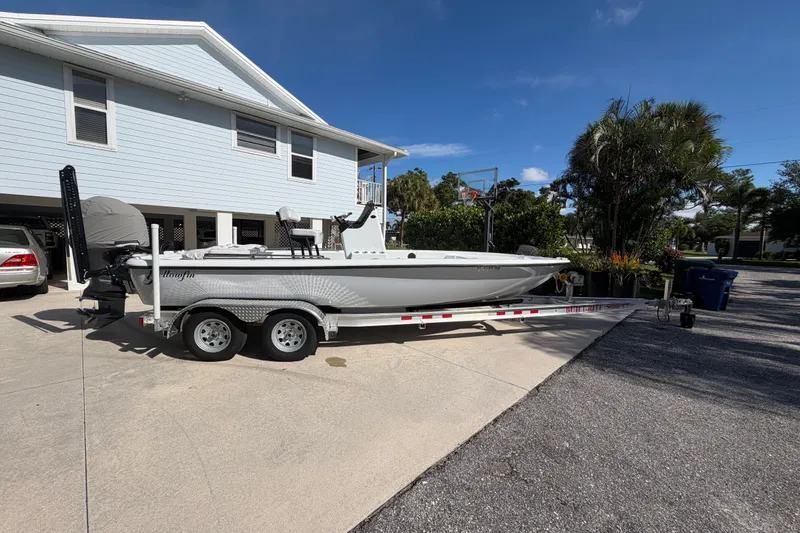 Slide: The Image of 2018 Yellowfin 21 Bay boat on trailer in driveway, sunny day. - 1