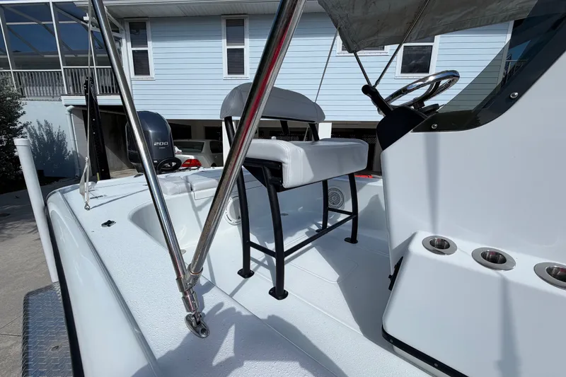Slide: The Image of 2018 Yellowfin 21 Bay boat interior with steering console and seating. - 28