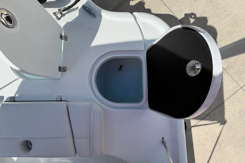 Slide: The Image of 2018 Yellowfin 21 Bay boat interior with open storage compartments. - 22