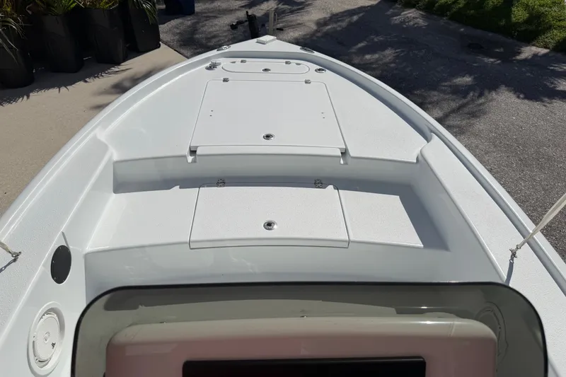 Slide: The Image of 2018 Yellowfin 21 Bay boat deck with storage compartments and clean design. - 36