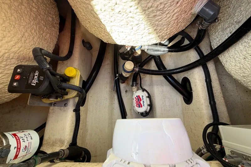 Slide: The Image of 2018 Yellowfin 21 Bay boat interior showing wiring and equipment setup. - 24