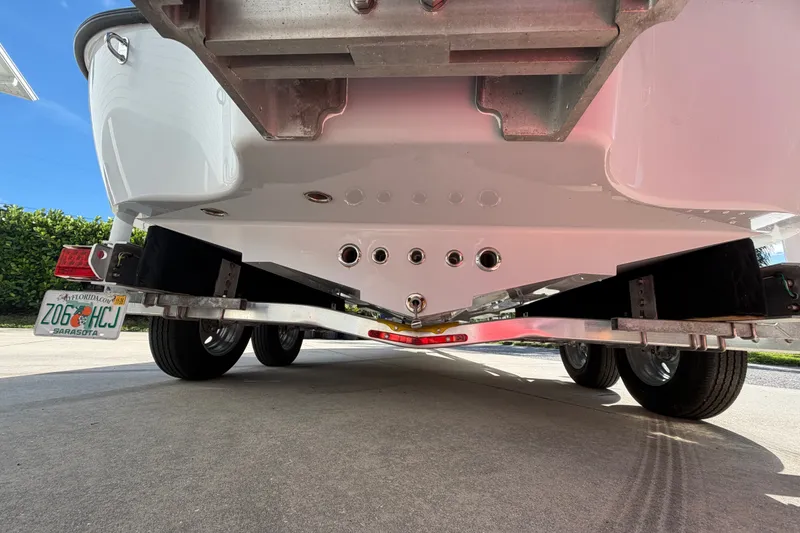 Slide: The Image of 2018 Yellowfin 21 Bay boat on trailer, rear view, Florida license plate visible. - 5