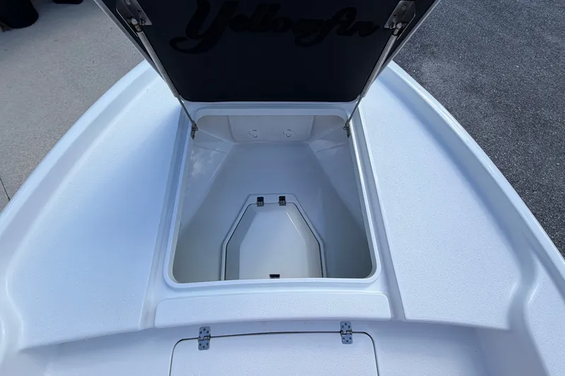 Slide: The Image of Open storage compartment on a 2018 Yellowfin 21 Bay boat, showcasing interior space. - 39