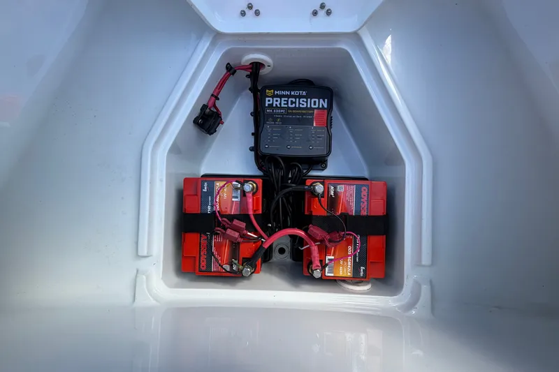 Slide: The Image of Battery compartment of 2018 Yellowfin 21 Bay boat with Minn Kota Precision charger. - 40
