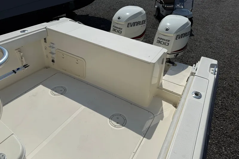 Slide: The Image of 2000 Pursuit 2870 Offshore Center Console boat with twin Evinrude 300 engines. - 11