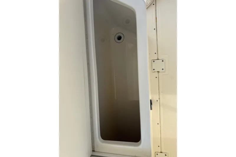 Slide: The Image of Storage compartment on a 2000 Pursuit 2870 Offshore Center Console boat. - 10