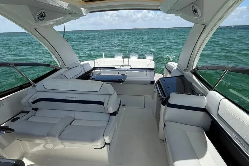 Slide: The Image of 2022 Formula 350 Crossover Bowrider interior with luxurious seating on open water. - 12