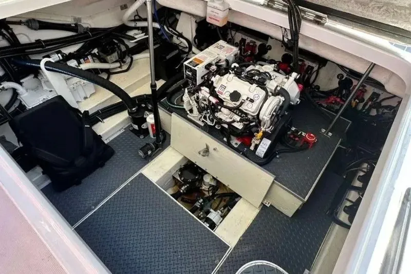 Slide: The Image of Engine compartment of 2022 Formula 350 Crossover Bowrider, showcasing detailed mechanical components. - 14