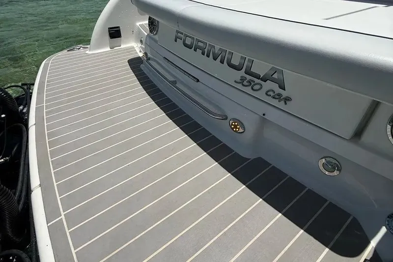 Slide: The Image of 2022 Formula 350 Crossover Bowrider boat deck with sleek design and branding. - 11
