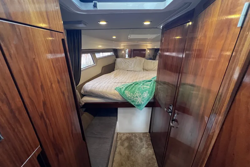 Slide: The Image of Luxurious cabin interior of 2024 Aquador 300 HT yacht with cozy bedding. - 43
