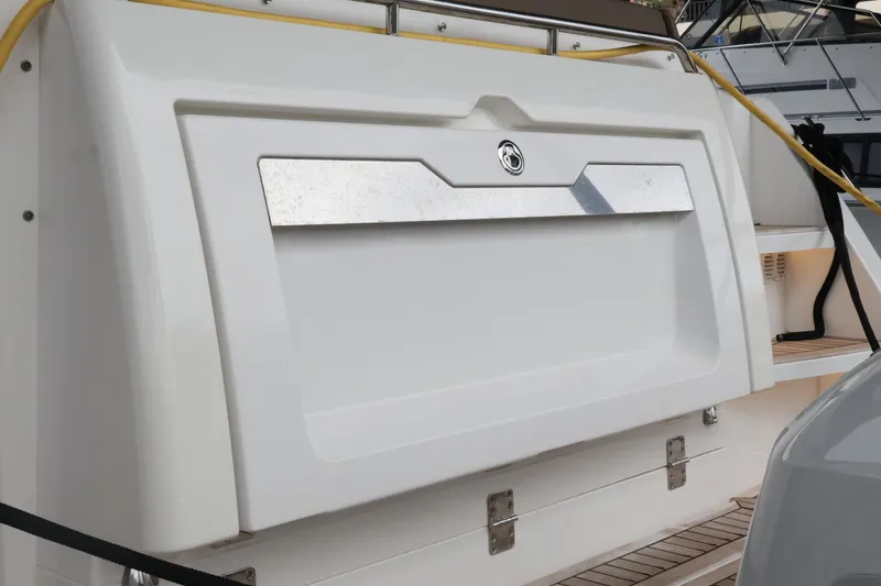 Slide: The Image of 2024 Aquador 300 HT yacht stern with sleek design and modern features. - 60