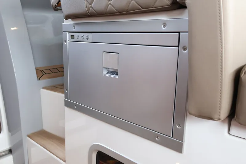 Slide: The Image of 2024 Aquador 300 HT interior with built-in stainless steel appliance. - 36