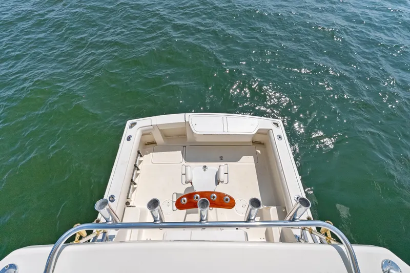 Slide: The Image of 1995 Pursuit 3000 Offshore boat deck overlooking sparkling ocean water. - 37