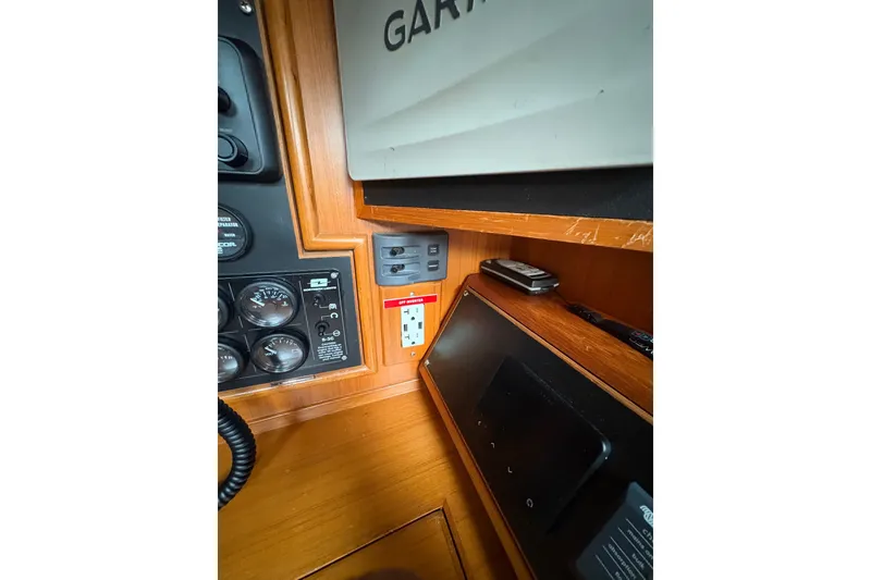 Slide: The Image of Control panel and electronics inside a 1998 Hylas 46 yacht cabin. - 19