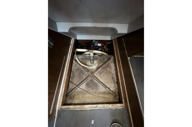 Slide: The Image of Bilge area of a 1974 Bertram 31 Flybridge Cruiser, showing pipes and fittings. - 41