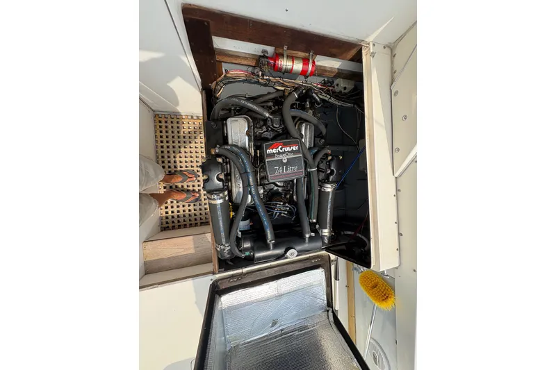 Slide: The Image of Engine compartment of a 1974 Bertram 31 Flybridge Cruiser with MerCruiser 7.4L engine. - 42
