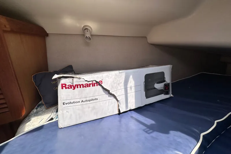 Slide: The Image of Damaged Raymarine Evolution Autopilots box inside a 1997 Hunter 34 boat cabin. - 25