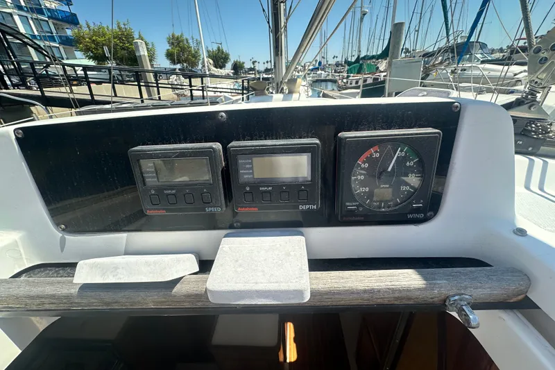 Slide: The Image of Control panel of a 1997 Hunter 34 sailboat with speed, depth, and wind gauges. - 15