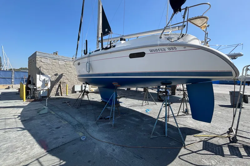 Slide: The Image of Hunter 34 sailboat from 1997 on dry dock for maintenance. - 30