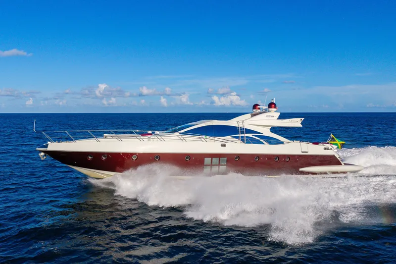 Slide: The Image of 2009 Azimut 86S yacht cruising on open sea under clear blue sky. - 33