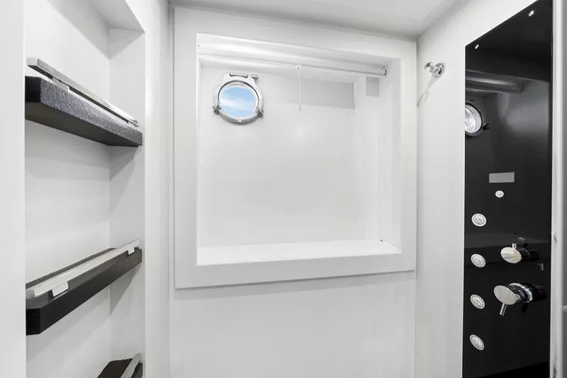 Slide: The Image of Luxurious 2009 Azimut 86S yacht interior with modern shower and sleek design elements. - 100