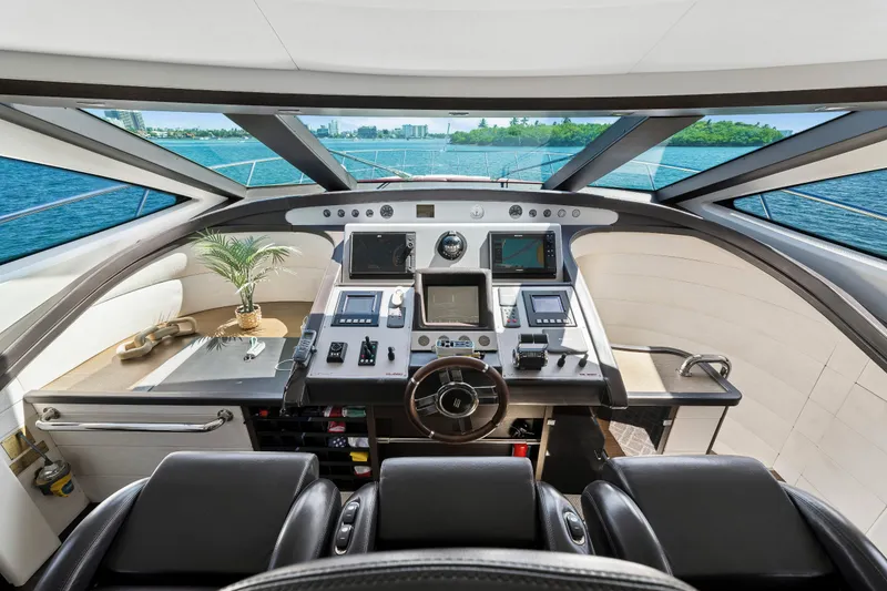 Slide: The Image of Cockpit of 2009 Azimut 86S yacht with modern navigation equipment and ocean view. - 82