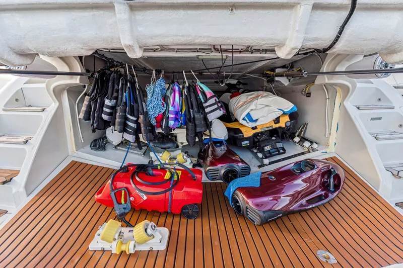 Slide: The Image of Storage area on 2009 Azimut 86S yacht with life vests and water sports equipment. - 124