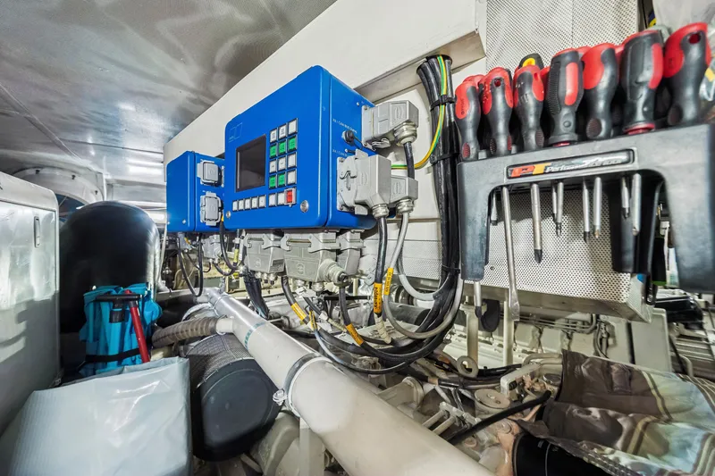 Slide: The Image of Engine room of 2009 Azimut 86S yacht with control panel and tools. - 122
