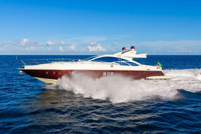 Slide: The Image of 2009 Azimut 86S yacht cruising on open sea under clear blue sky. - 32