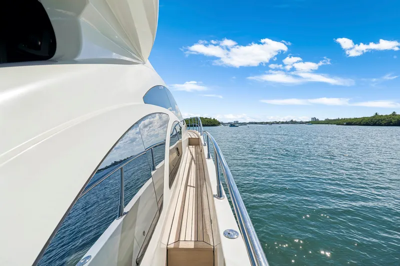 Slide: The Image of Side view of a 2009 Azimut 86S yacht cruising on a sunny day. - 63