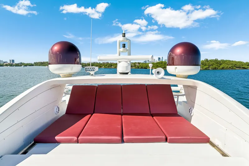 Slide: The Image of Luxurious 2009 Azimut 86S yacht with red sunbeds on deck, under a clear blue sky. - 71