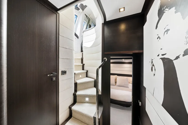 Slide: The Image of Luxurious interior of 2009 Azimut 86S yacht with modern staircase and elegant decor. - 88