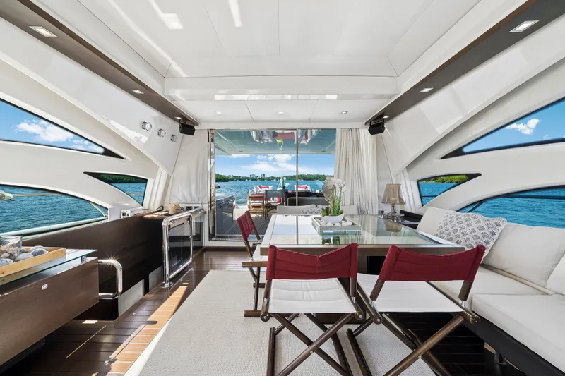 Slide: The Image of Luxurious interior of 2009 Azimut 86S yacht with elegant seating and panoramic windows. - 76