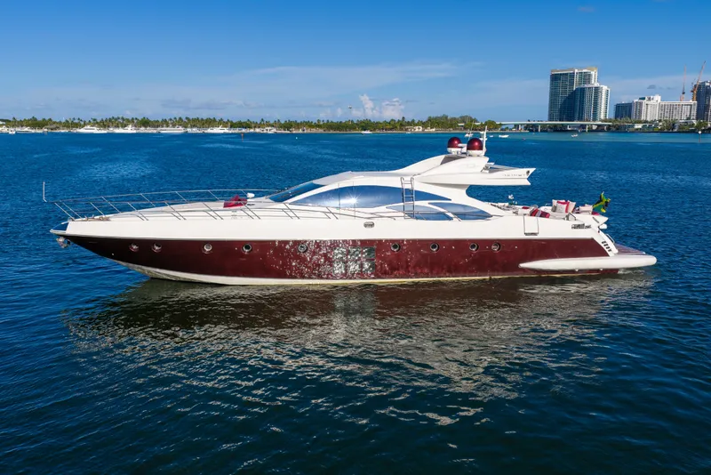 Slide: The Image of Luxurious 2009 Azimut 86S yacht cruising on a sunny day near a city skyline. - 14