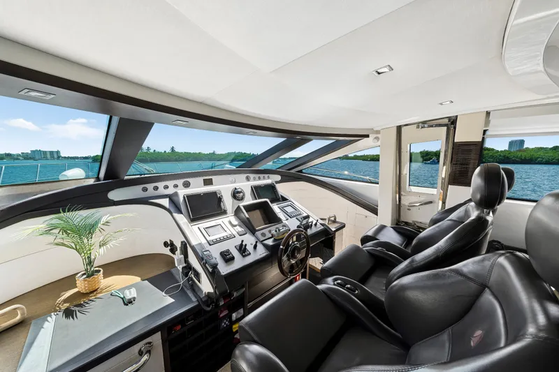Slide: The Image of Luxurious 2009 Azimut 86S yacht cockpit with leather seats and modern navigation controls. - 81