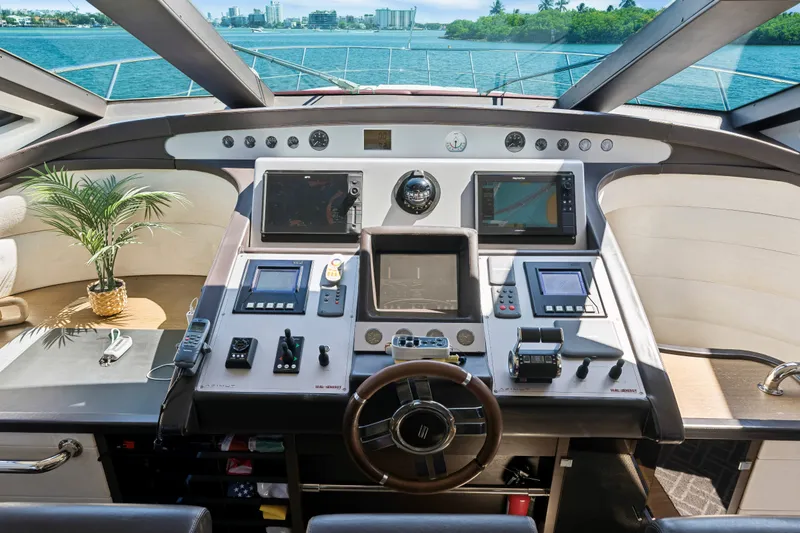 Slide: The Image of Cockpit of 2009 Azimut 86S yacht with modern navigation equipment and scenic ocean view. - 83