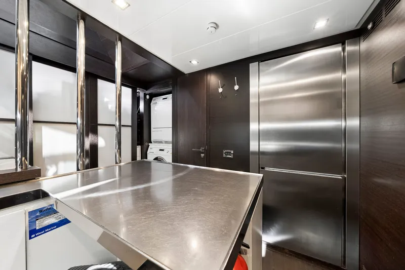 Slide: The Image of Modern kitchen interior on a 2009 Azimut 86S yacht with stainless steel appliances. - 115