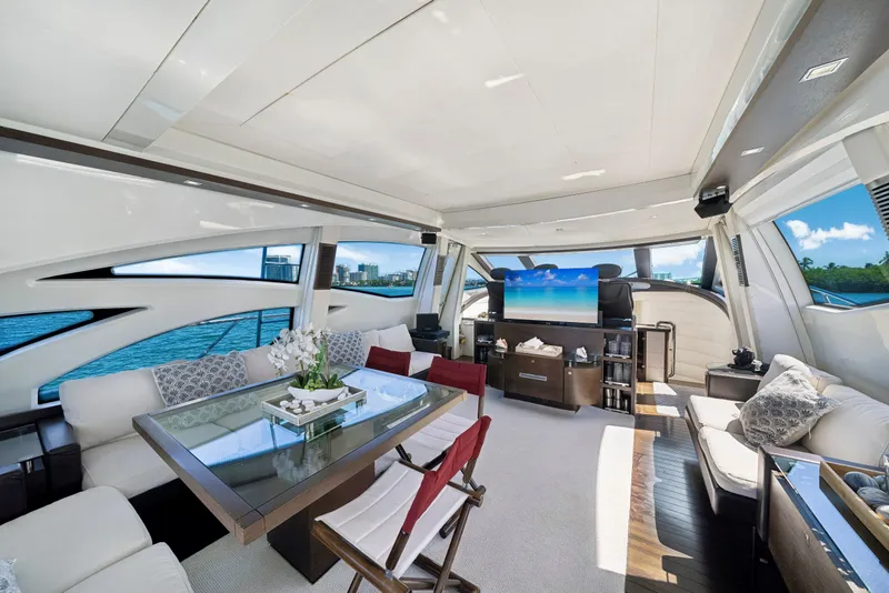 Slide: The Image of Luxurious interior of a 2009 Azimut 86S yacht with elegant seating and panoramic windows. - 80