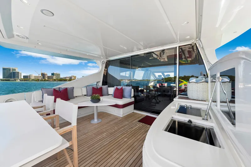 Slide: The Image of Luxurious 2009 Azimut 86S yacht deck with seating, ocean view, and modern amenities. - 58