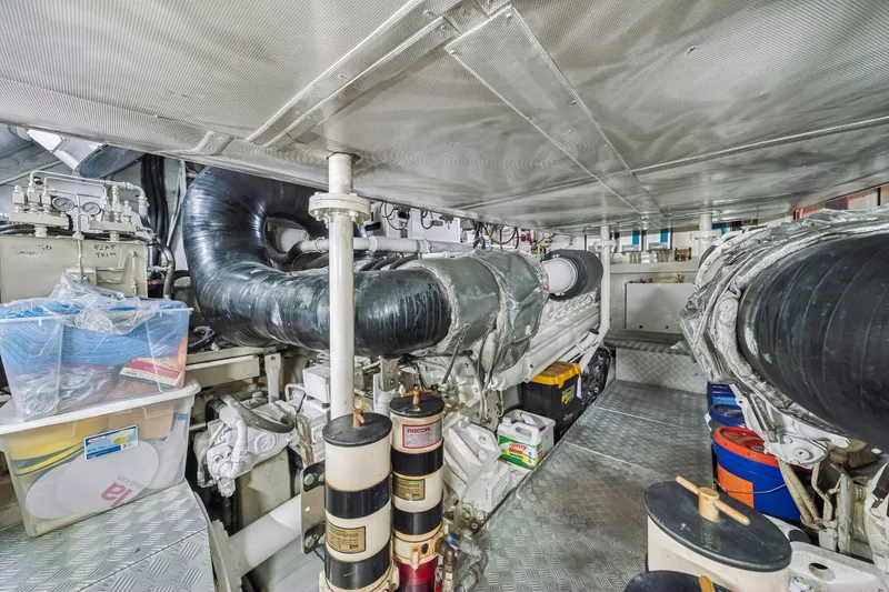 Slide: The Image of Engine room of a 2009 Azimut 86S yacht, showcasing machinery and components. - 118