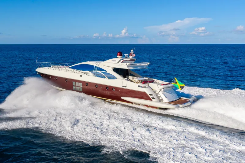 Slide: The Image of 2009 Azimut 86S yacht cruising on open sea under clear blue sky. - 37