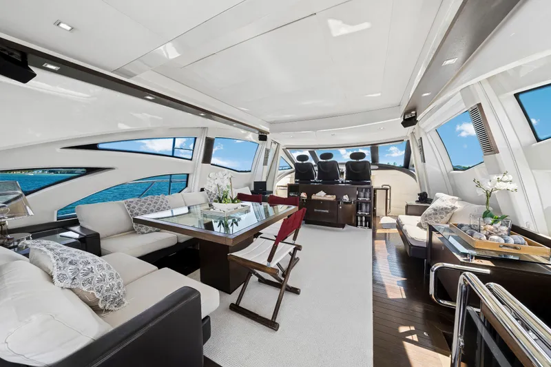 Slide: The Image of Luxurious interior of a 2009 Azimut 86S yacht with elegant seating and panoramic windows. - 72
